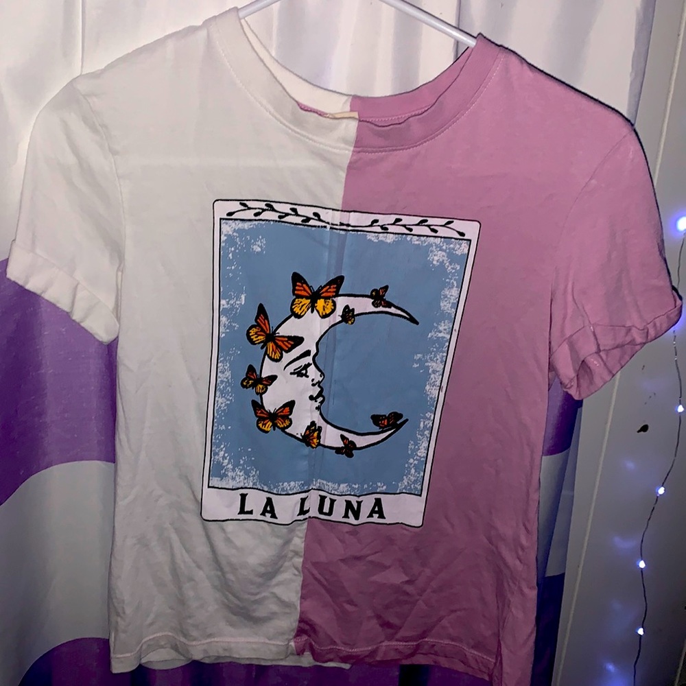 This is a kids tee from vibe’n and purple and white.